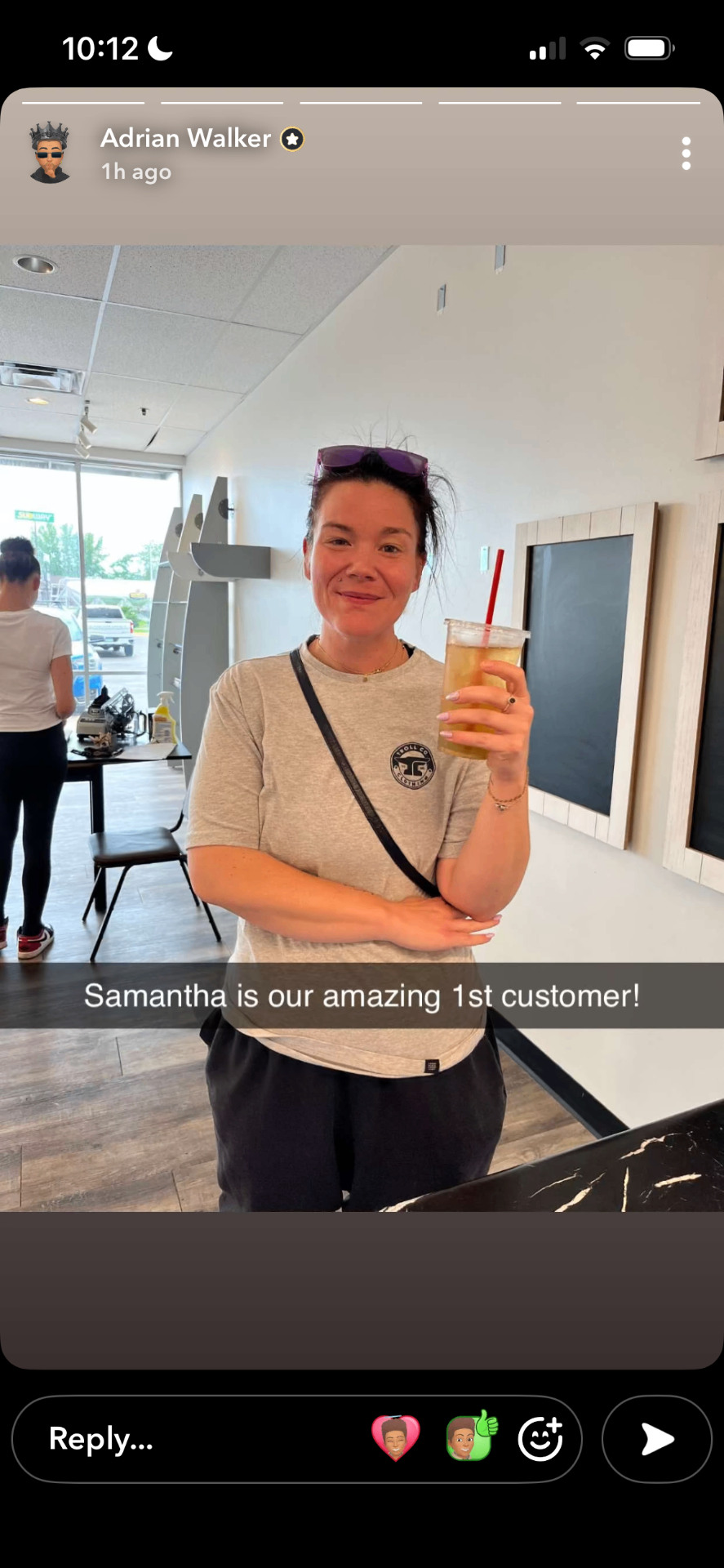 Samantha — the very first customer at Clearwater Blending Company, holding a loaded tea